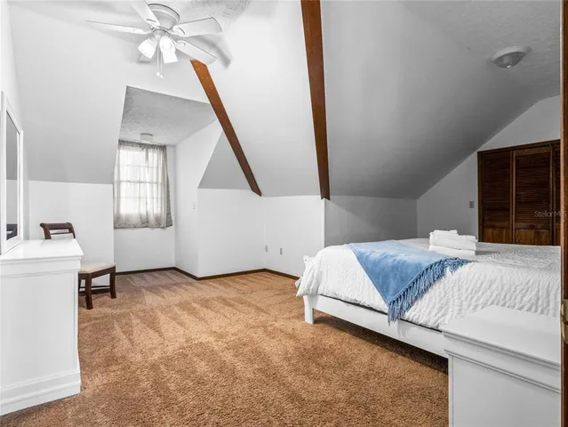 a view of a swimming pool with lounge chair