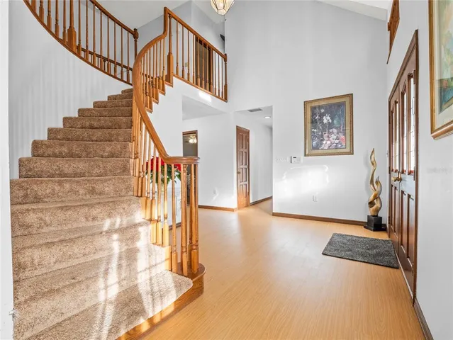 a kitchen with granite countertop white cabinets and white stainless steel appliances