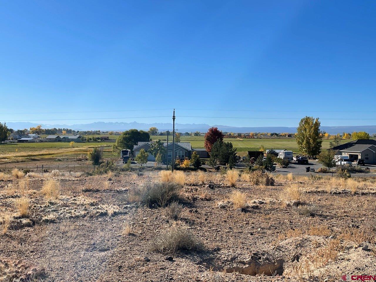 Lot 3 6125th Road Olathe, CO 81425 - Photo 2 of 8 a view of a lake with beach and city view