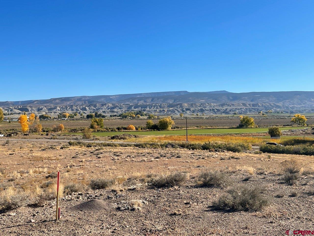 Lot 3 6125th Road Olathe, CO 81425 - Photo 3 of 8 a view of a lake with mountain