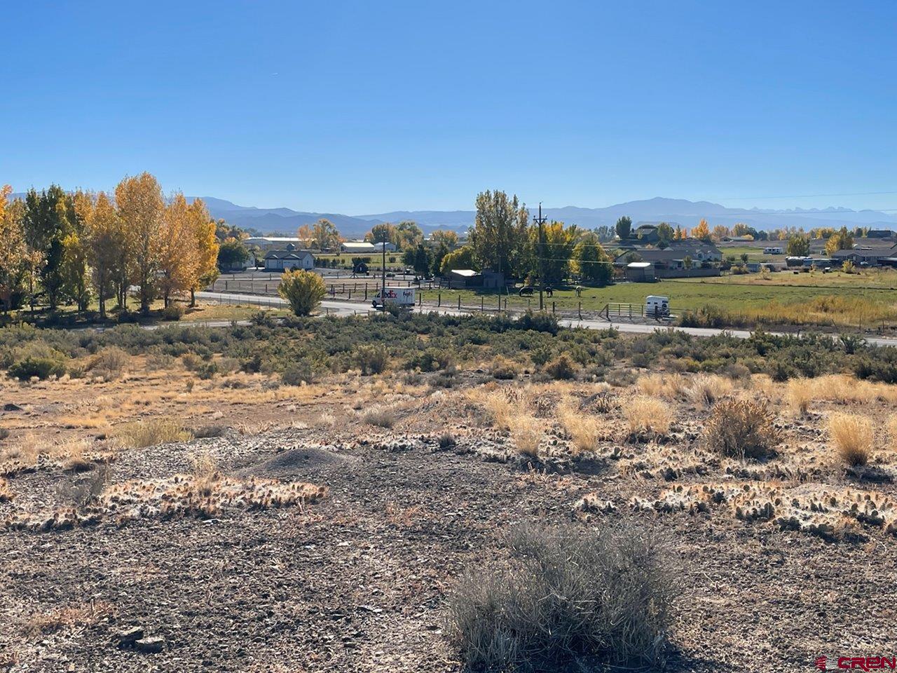 Lot 3 6125th Road Olathe, CO 81425 - Photo 5 of 8 a view of a dry yard with wooden fence