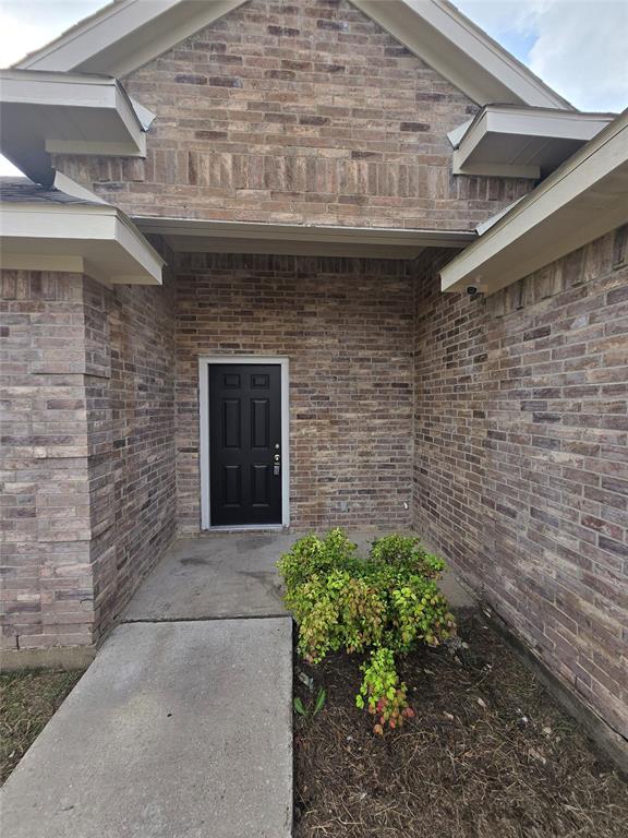 3038 Flask Drive Dallas, TX 75241 - Photo 11 of 12 a front view of a house with a garden