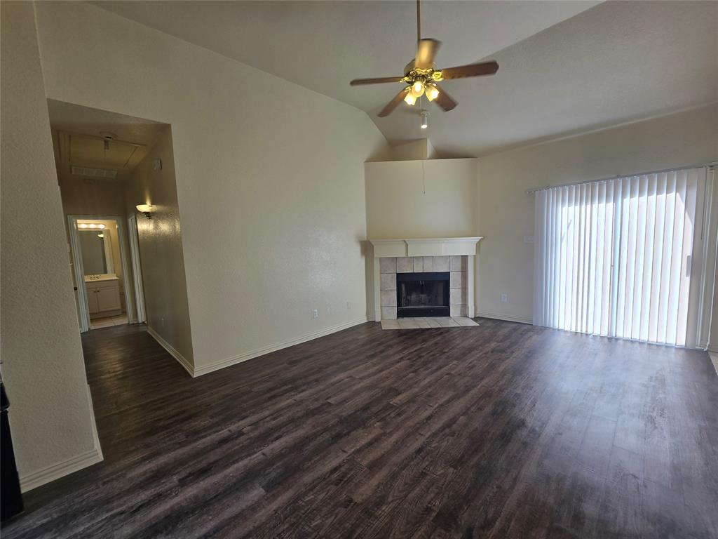3038 Flask Drive Dallas, TX 75241 - Photo 10 of 12 wooden floor in an empty room with a window