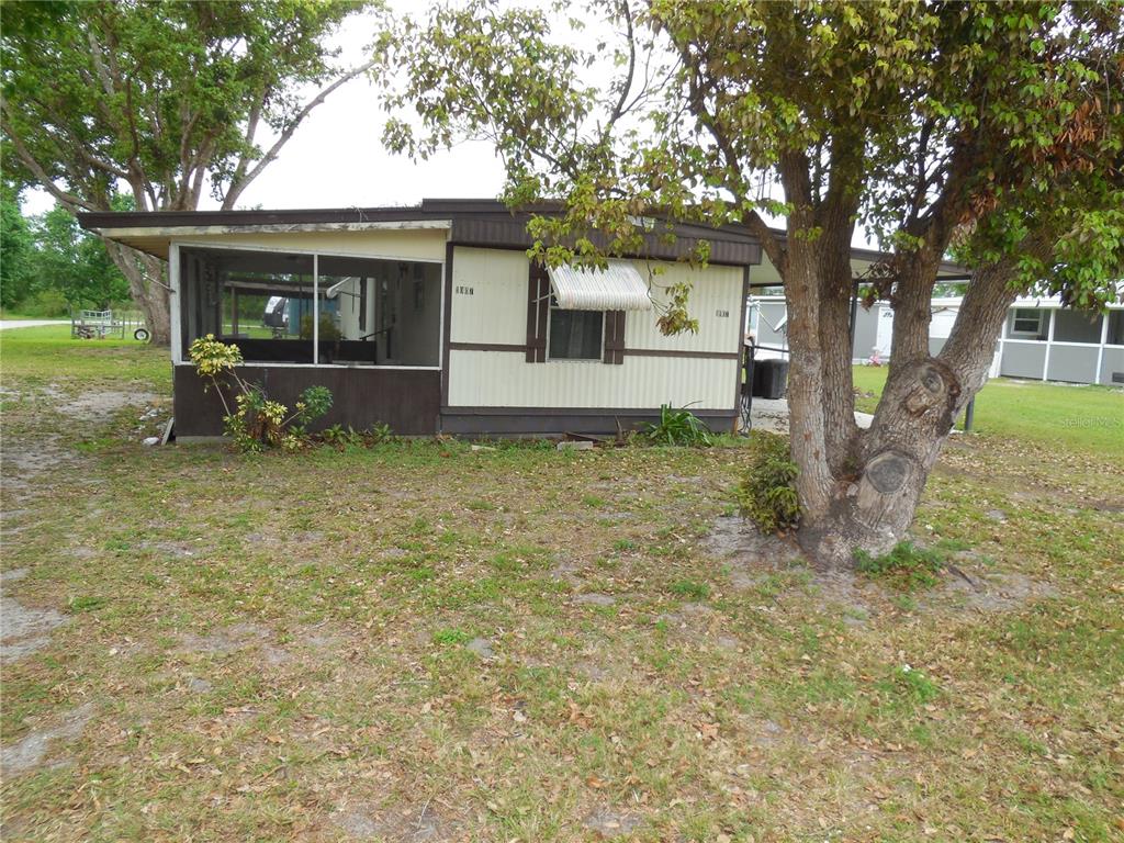 1007 Sparrow Road Wauchula, FL 33873 - Photo 17 of 42 a view of a house with a yard