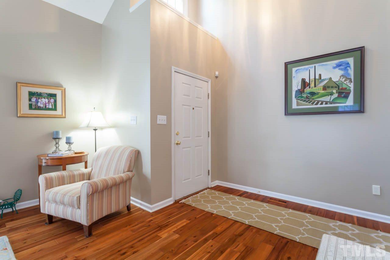 12308 Hartwick Court Raleigh, NC 27613 - Photo 11 of 20 a bedroom with a bed and wooden floor