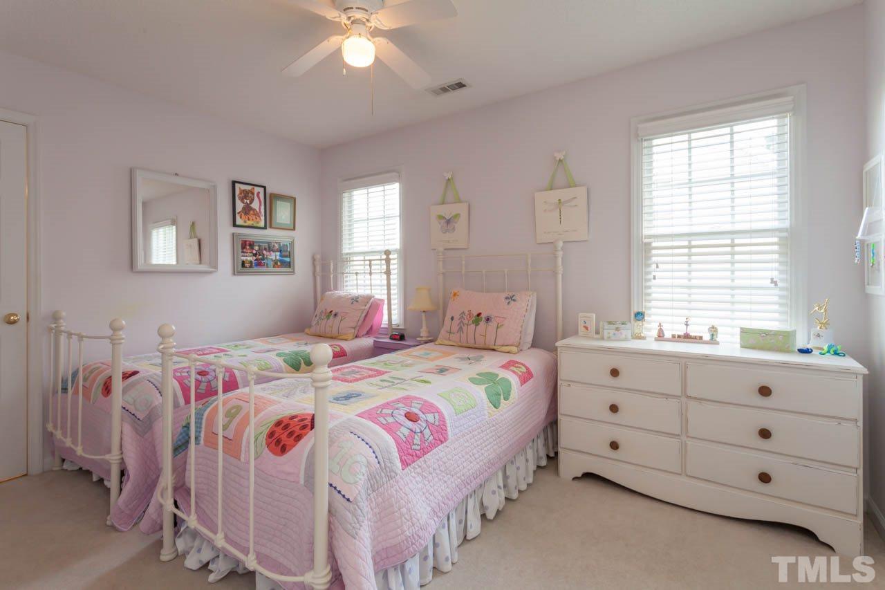 12308 Hartwick Court Raleigh, NC 27613 - Photo 16 of 20 a bedroom with a bed and a window