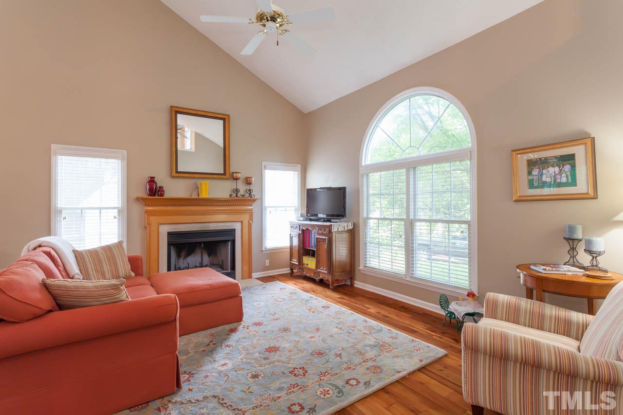 12308 Hartwick Court Raleigh, NC 27613 - Photo 3 of 20 a living room with furniture and a fireplace