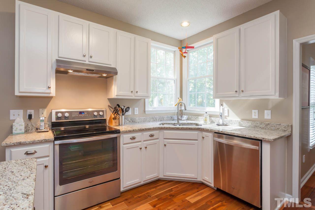 12308 Hartwick Court Raleigh, NC 27613 - Photo 6 of 20 a kitchen with appliances cabinets and a sink