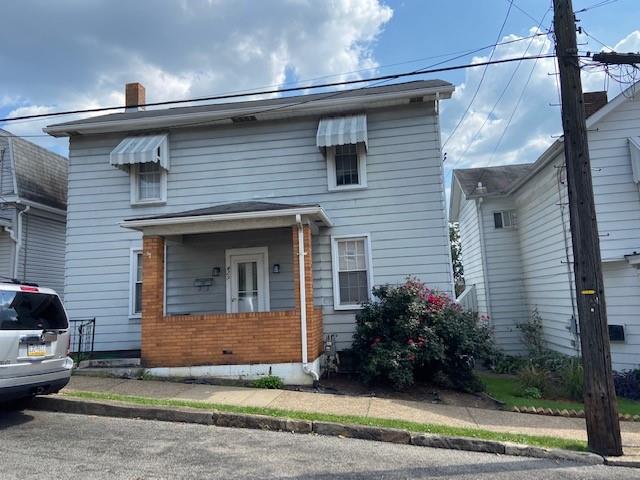 429 East Washington Street Rochester, PA 15074 - Photo 1 of 15 a front view of a house with garden
