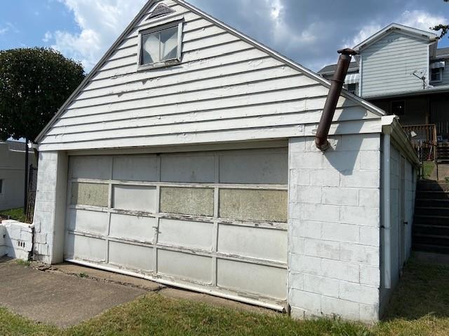 429 East Washington Street Rochester, PA 15074 - Photo 15 of 15 a view of a house with backyard and white door