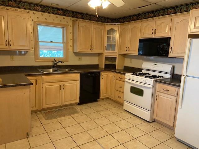 429 East Washington Street Rochester, PA 15074 - Photo 3 of 15 a kitchen with a stove a sink and a microwave