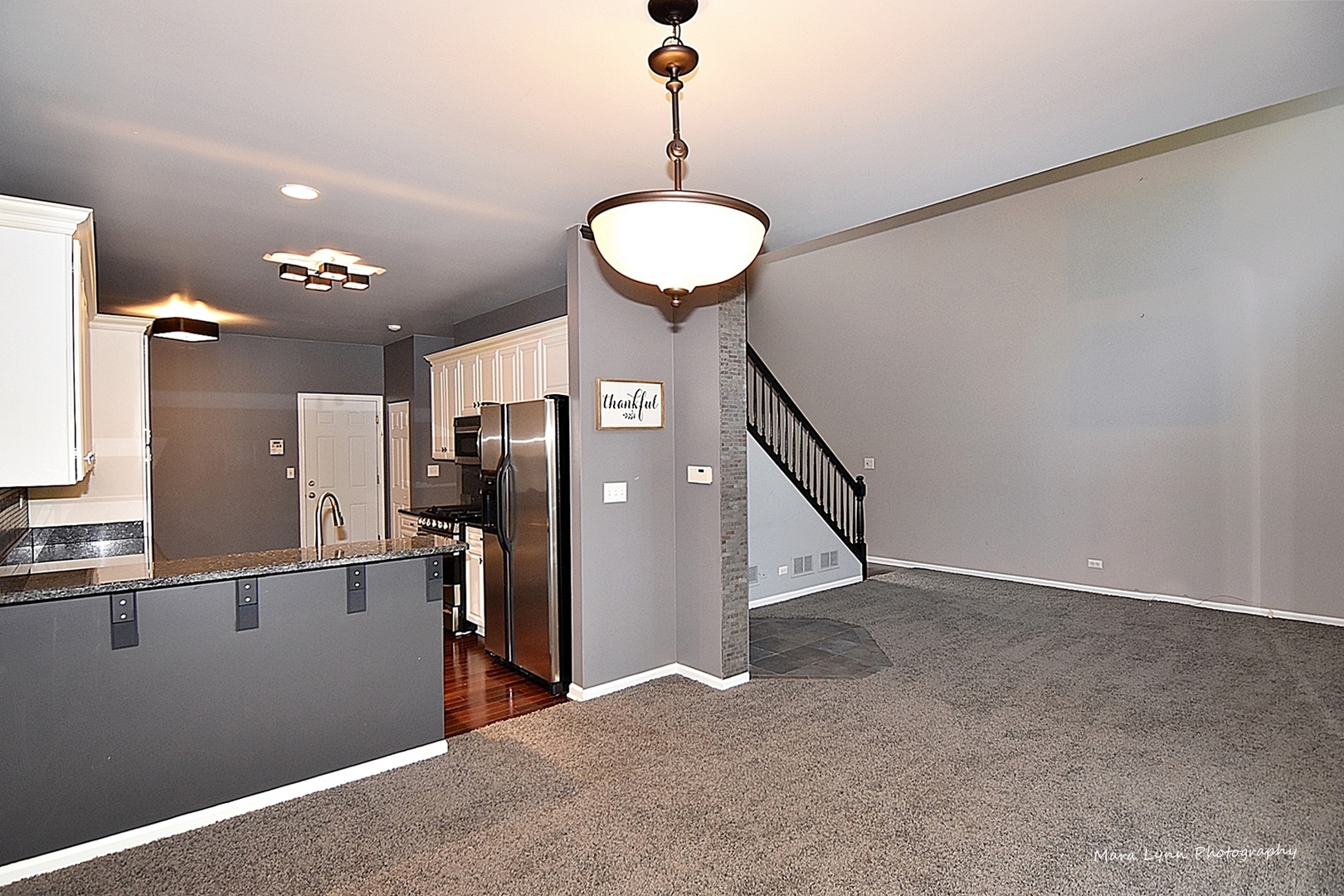 385 Ridge Road North Aurora, IL 60542 - Photo 7 of 30 a view of a hallway with a chandelier