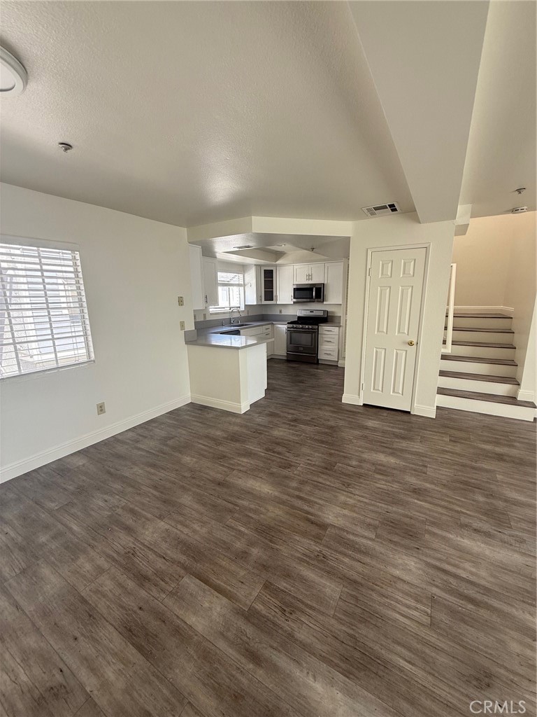 15642 Pasadena Avenue Tustin, CA 92780 - Photo 2 of 10 a view of a kitchen with wooden floor
