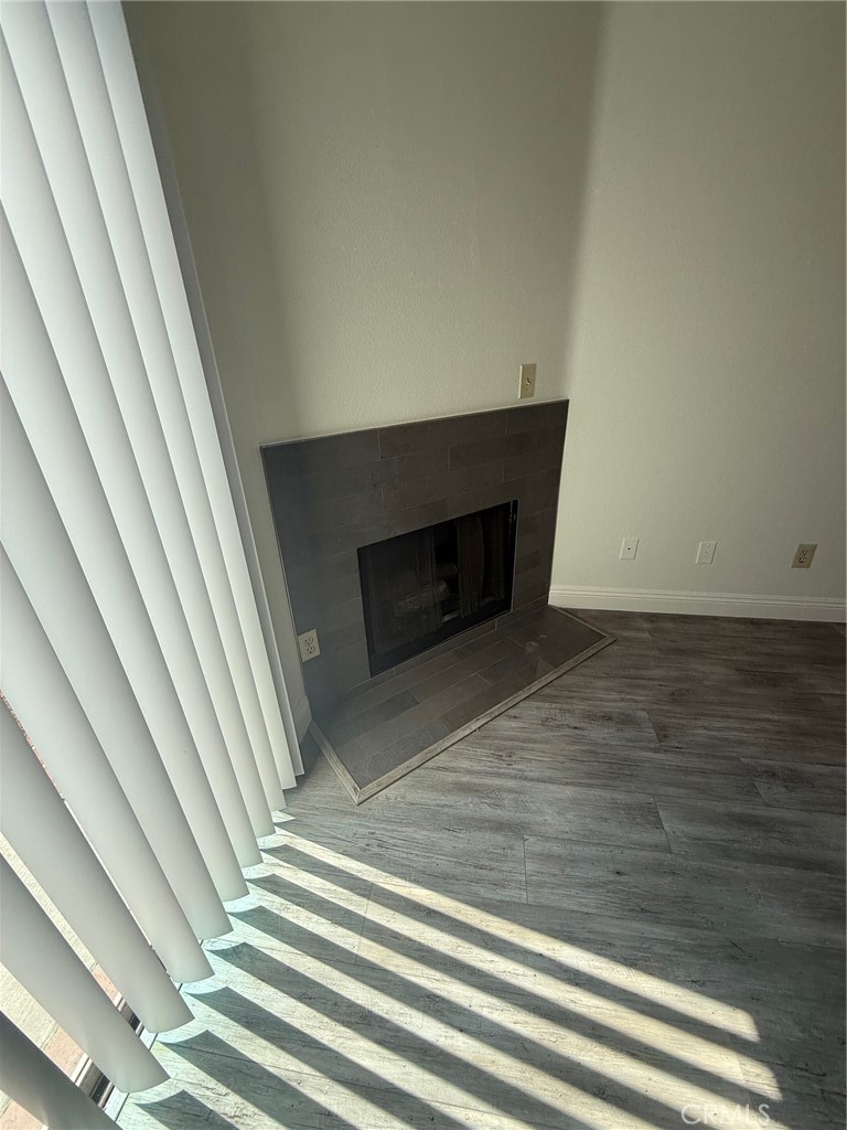 15642 Pasadena Avenue Tustin, CA 92780 - Photo 4 of 10 a view of a livingroom with wooden floor and staircase