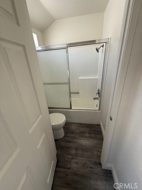 15642 Pasadena Avenue Tustin, CA 92780 - Photo 9 of 10 a bathroom with a granite countertop shower and a toilet