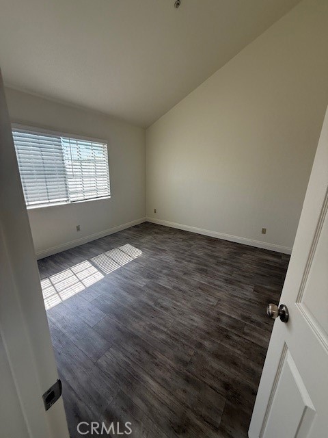 15642 Pasadena Avenue Tustin, CA 92780 - Photo 10 of 10 an empty room with wooden floor and windows