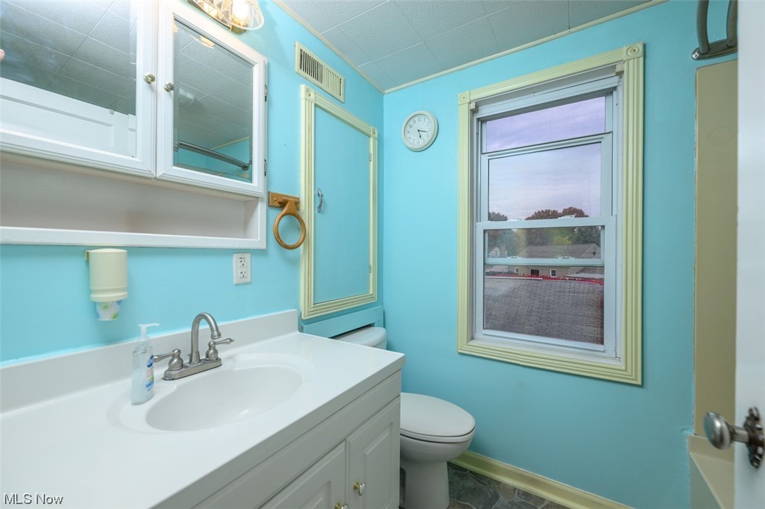 241 Everhard Road Southwest North Canton, OH 44709 - Photo 14 of 21 Full bathroom featuring vanity, mirror with storage and additional storage medicine cabinet