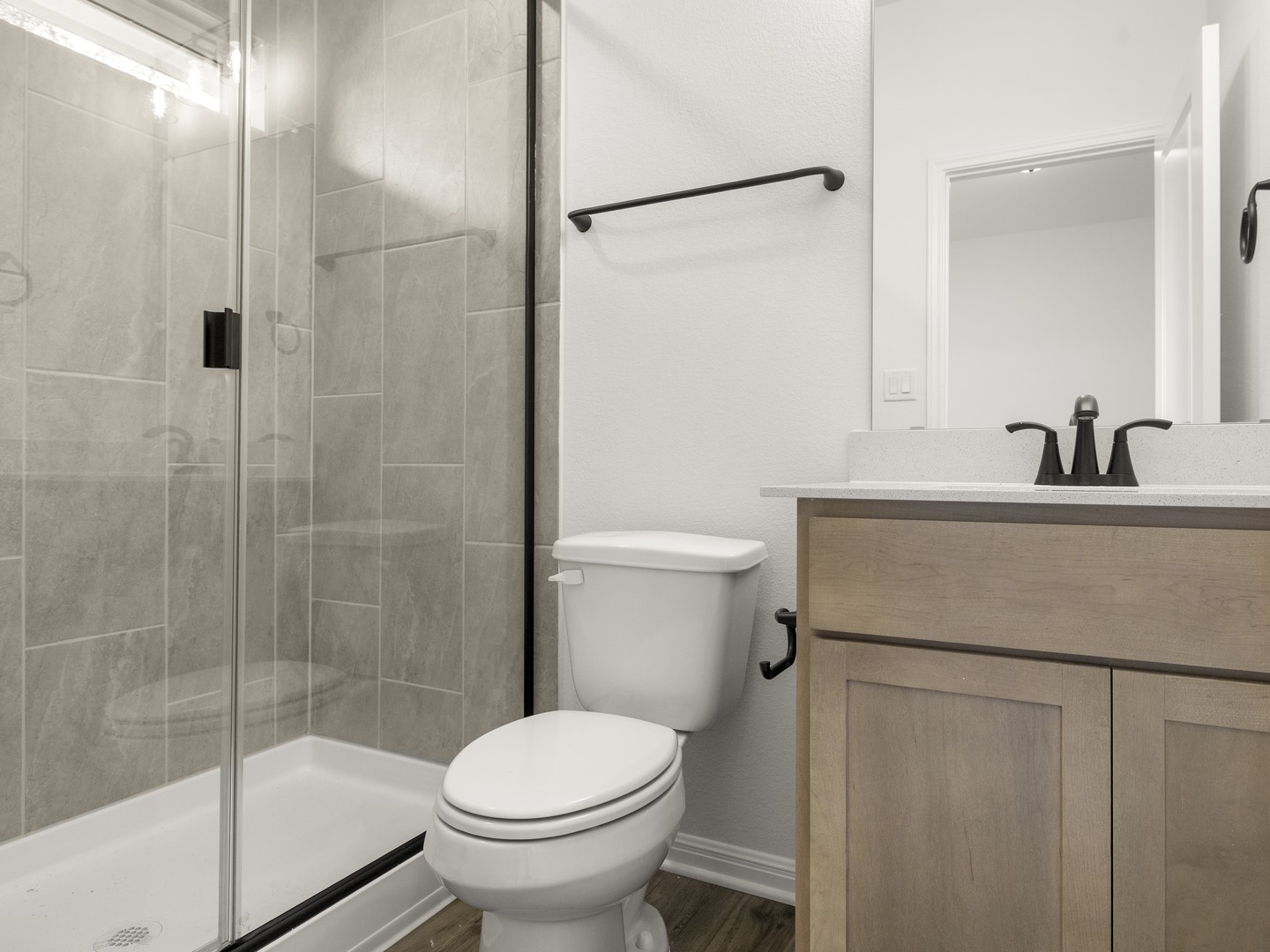 402 Judson Street Bertram, TX 78605 - Photo 20 of 27 a bathroom with a sink toilet and shower