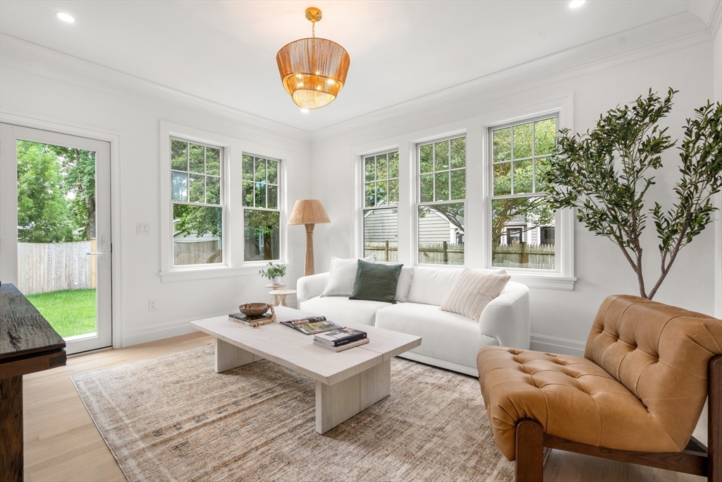 28 Parker Road Wellesley, MA 02482 - Photo 16 of 32 a living room with furniture a table and a large window