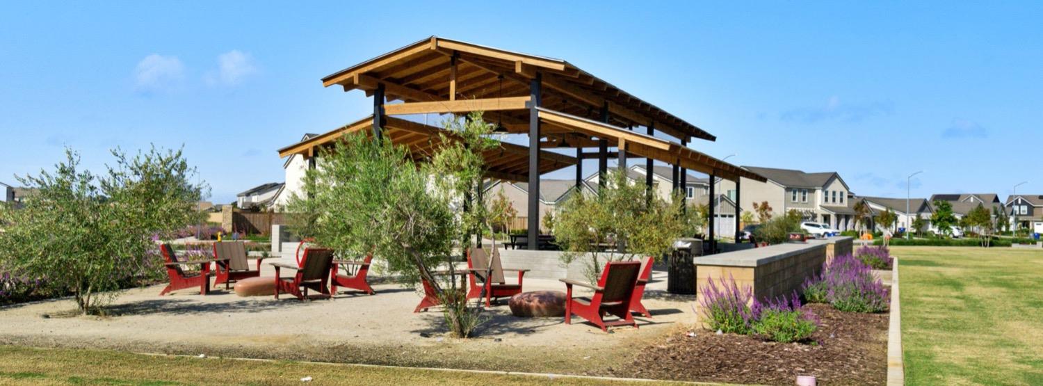 1010 Springtime Avenue, Unit 130 Clovis, CA 93619 - Photo 16 of 18 a view of a house with a small yard and furniture