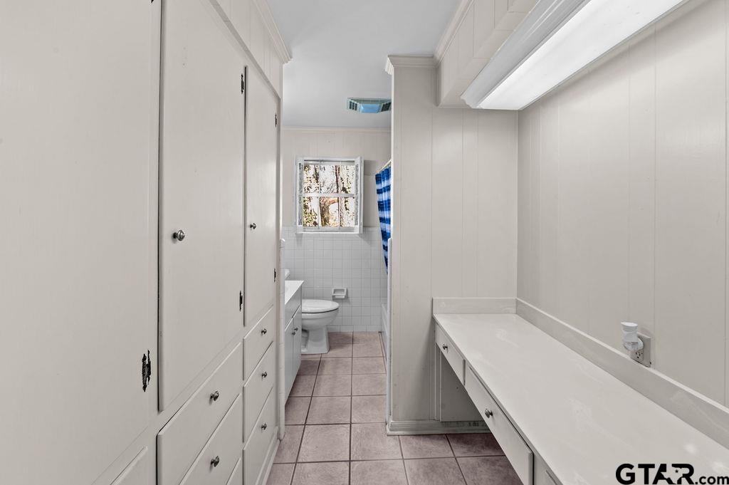 610 Tamy Street Quitman, TX 75783 - Photo 20 of 29 a bathroom with a toilet and a sink