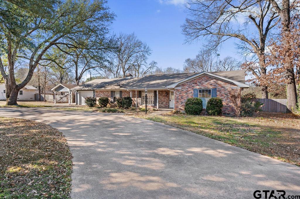 610 Tamy Street Quitman, TX 75783 - Photo 4 of 29 a front view of a house with a yard