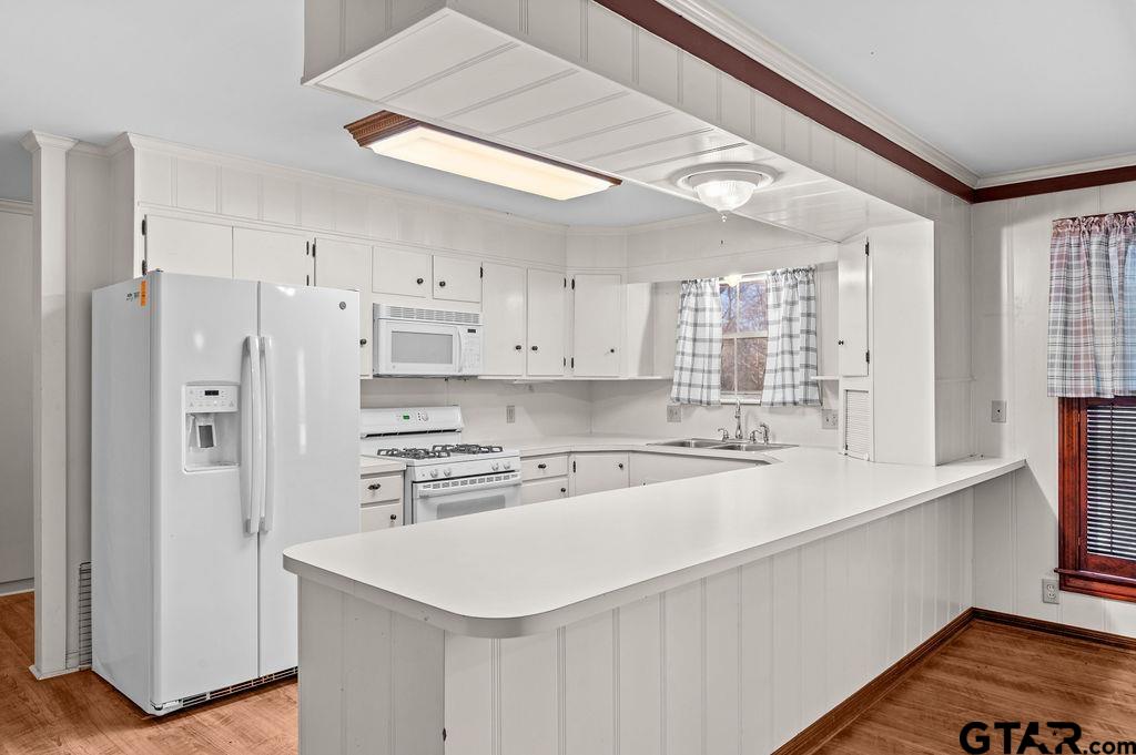 610 Tamy Street Quitman, TX 75783 - Photo 9 of 29 a kitchen with stainless steel appliances a sink a stove a refrigerator and cabinets