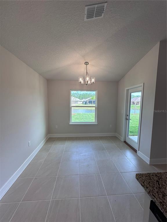 90 Rivertown Road Palm Coast, FL 32137 - Photo 16 of 60 an empty room with windows