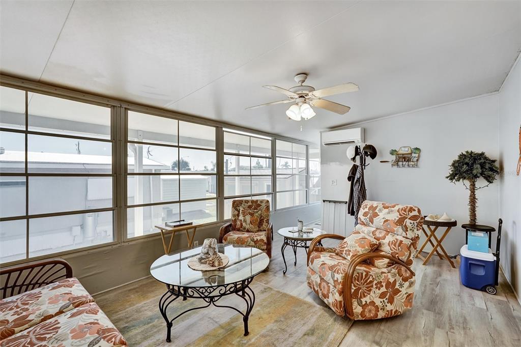 10315 Cortez Road West, Unit 19H Bradenton, FL 34210 - Photo 15 of 47 a living room with furniture and a large window