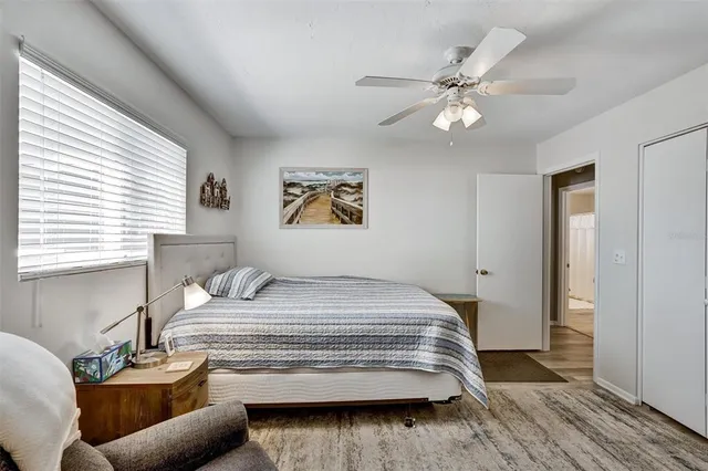 a bedroom with a bed and window