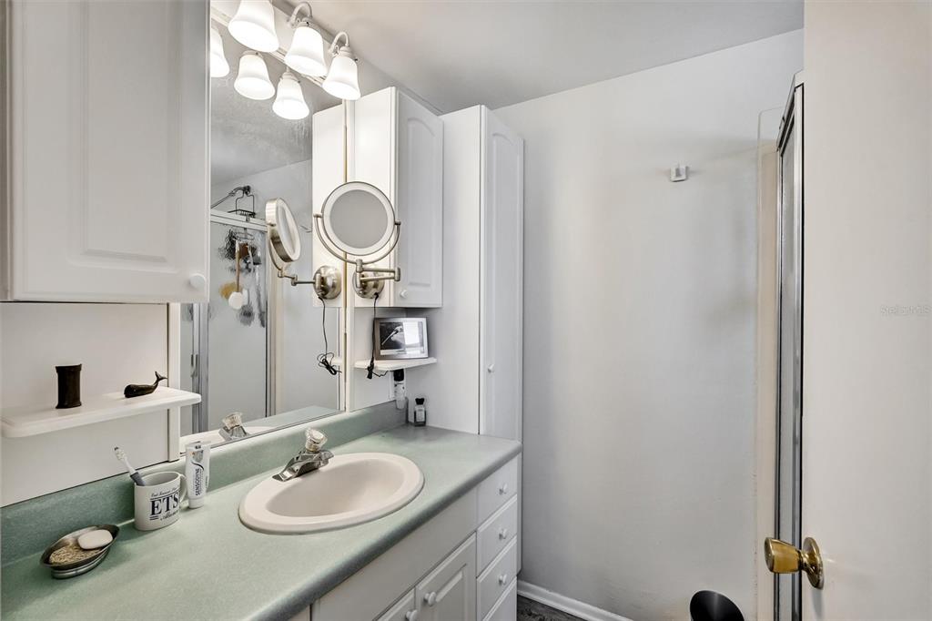 10315 Cortez Road West, Unit 19H Bradenton, FL 34210 - Photo 20 of 47 a bathroom with a sink vanity granite and a mirror
