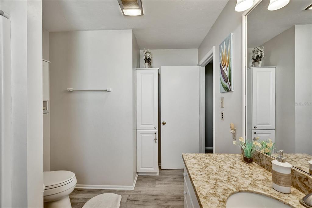 10315 Cortez Road West, Unit 19H Bradenton, FL 34210 - Photo 26 of 47 a bathroom with a granite countertop sink toilet and shower