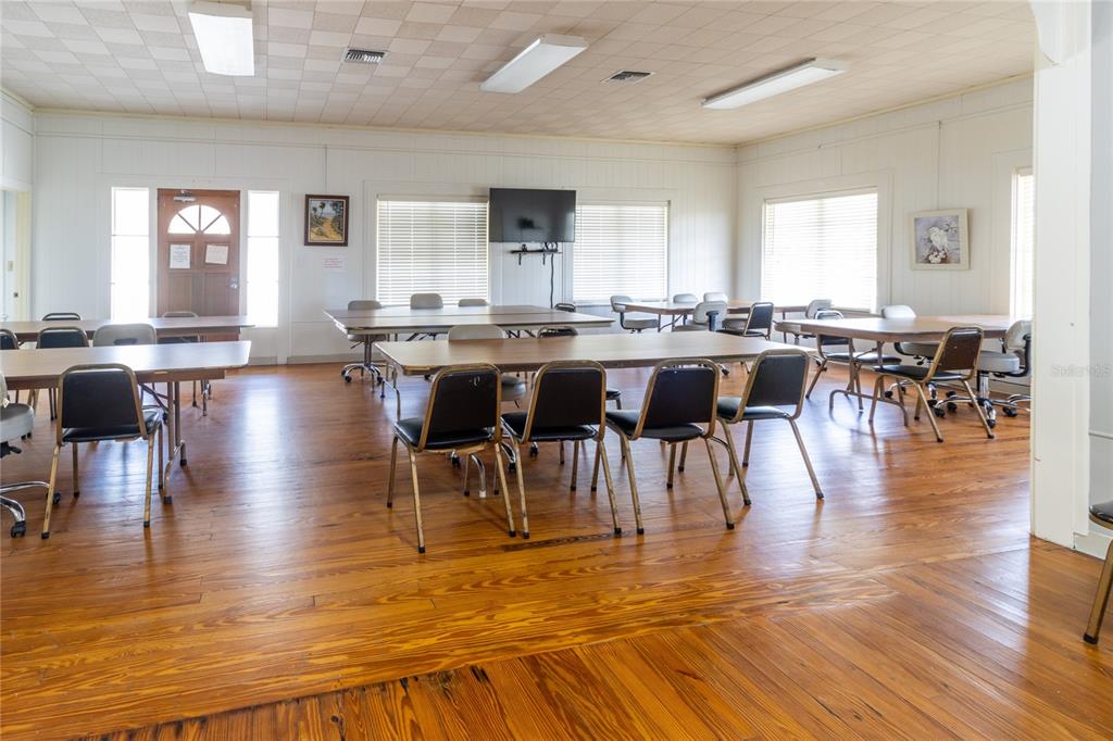 10315 Cortez Road West, Unit 19H Bradenton, FL 34210 - Photo 37 of 45 a view of a dining room with furniture wooden floor and windows