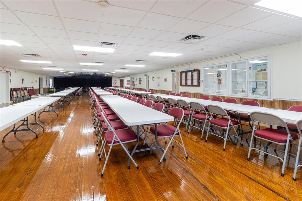 10315 Cortez Road West, Unit 19H Bradenton, FL 34210 - Photo 40 of 45 a table room with wooden floor and furniture