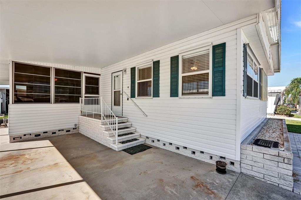 10315 Cortez Road West, Unit 19H Bradenton, FL 34210 - Photo 4 of 47 a view of a patio with table and chairs
