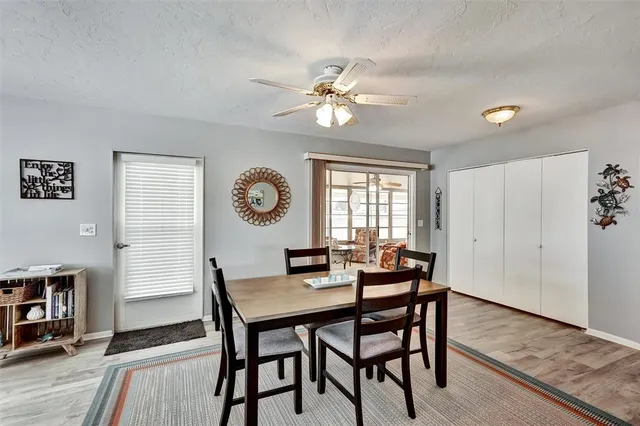 a dining room with furniture and window