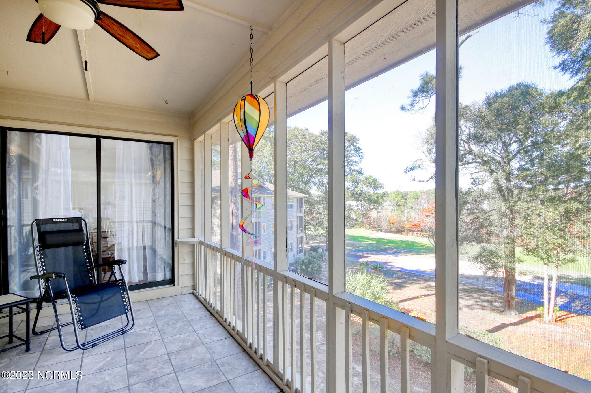 225 Clubhouse Road, Unit 706 Sunset Beach, NC 28468 - Photo 13 of 37 Spacious 16x8 Screened Porch with a nice view of the golf course and pond.