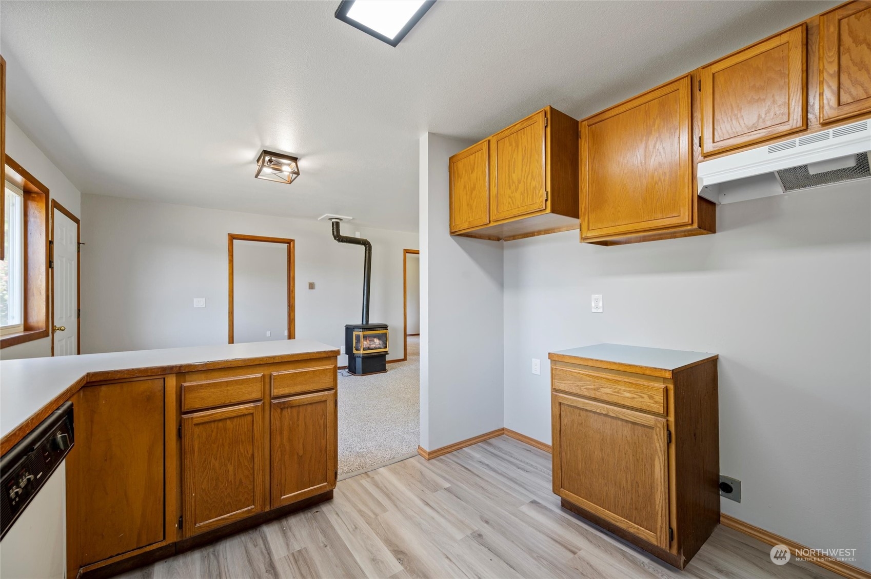 8879 Stein Road Custer, WA 98240 - Photo 12 of 22 a kitchen with stainless steel appliances granite countertop wooden cabinets a stove a sink and dishwasher