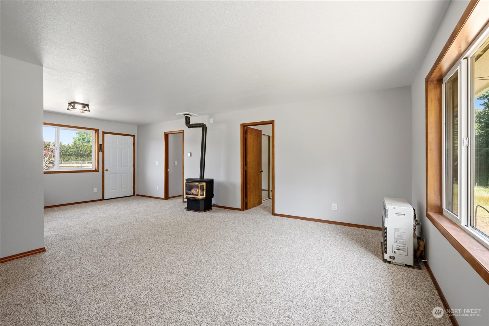 8879 Stein Road Custer, WA 98240 - Photo 7 of 22 an empty room with windows and closet