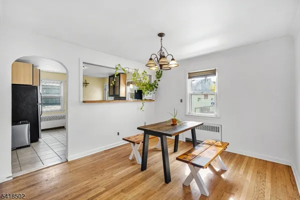 a kitchen with stainless steel appliances granite countertop a refrigerator and a stove