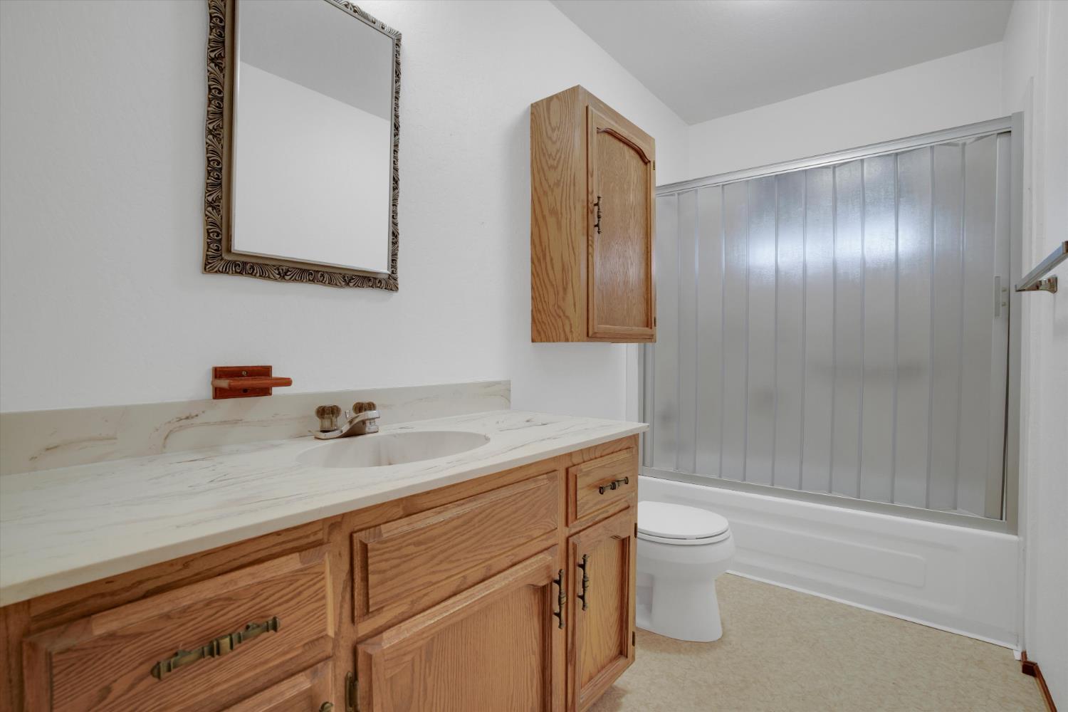 12066 Breckenridge Road Groveland, CA 95321 - Photo 14 of 41 a bathroom with a sink a toilet and shower