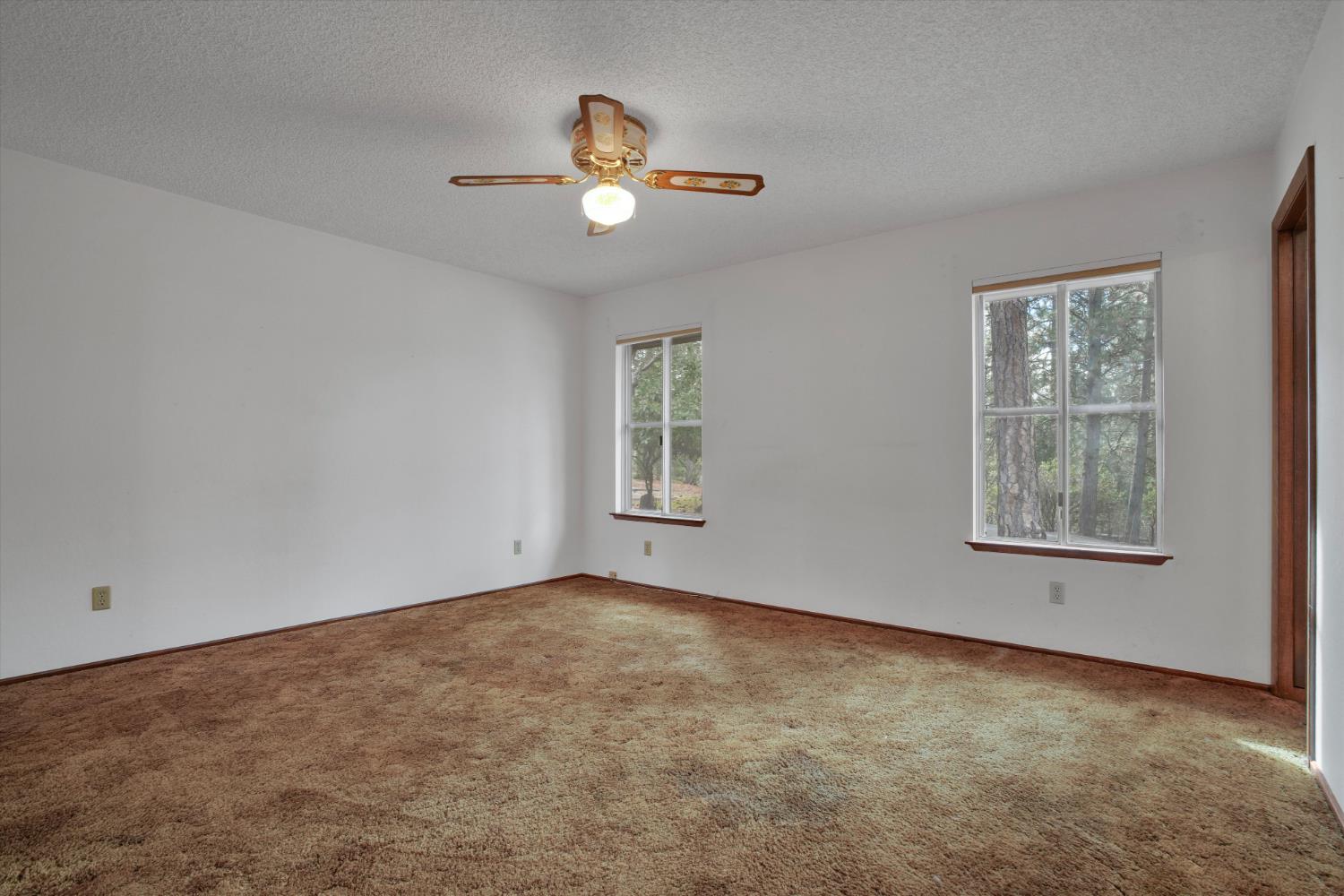 12066 Breckenridge Road Groveland, CA 95321 - Photo 17 of 41 an empty room with windows