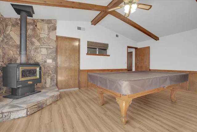 a living room with stainless steel appliances kitchen island granite countertop furniture