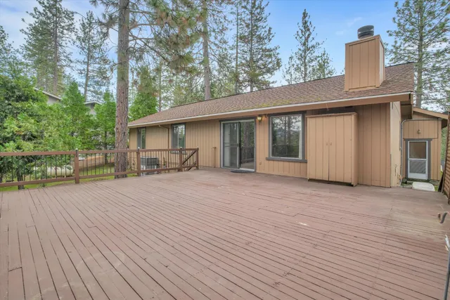 a front view of a house with a garden and pathway