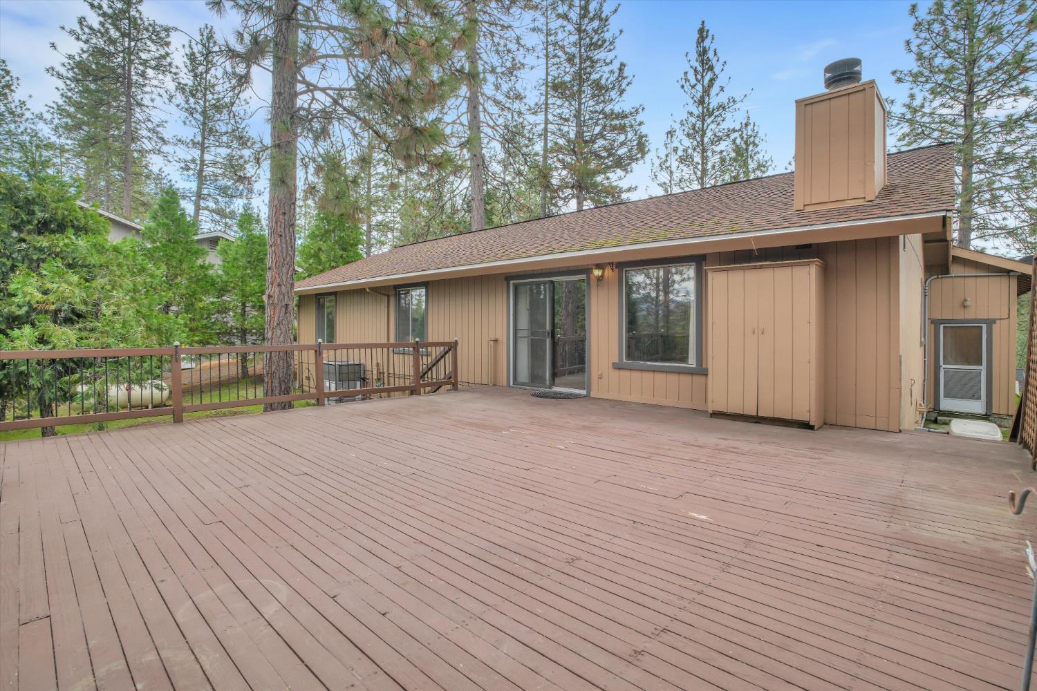 12066 Breckenridge Road Groveland, CA 95321 - Photo 28 of 41 a front view of a house with a garden and pathway