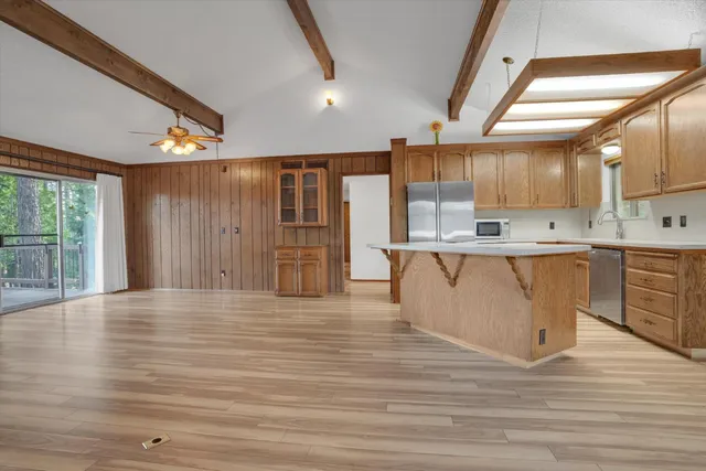 a view of kitchen with cabinets and wooden floor