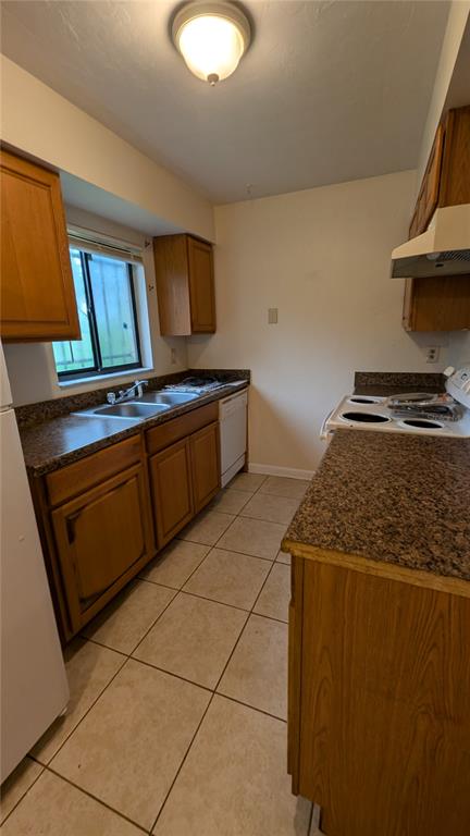 625 Southwest 67th Terrace, Unit A B C D Gainesville, FL 32607 - Photo 4 of 8 a kitchen with granite countertop a stove and a sink