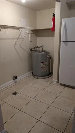 a kitchen with a refrigerator and cabinets