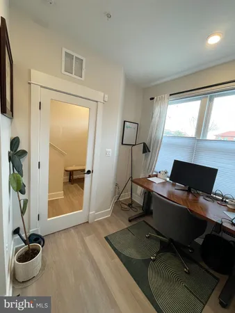 a workspace with furniture and window