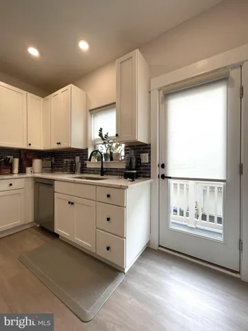 a view of roof deck with seating area